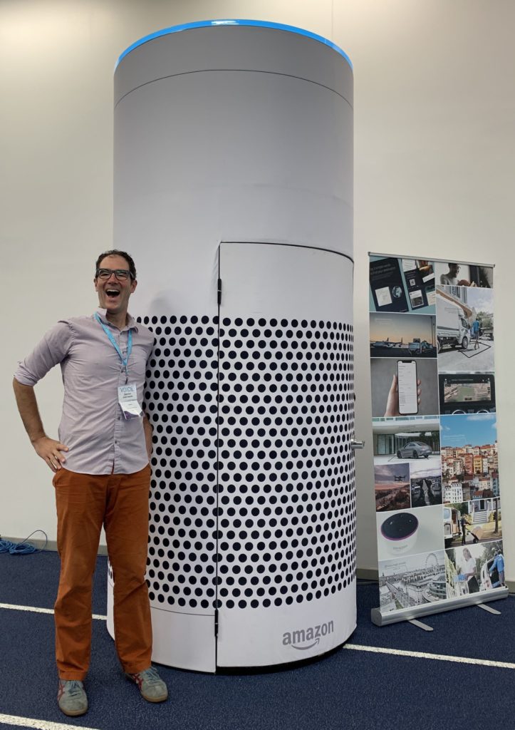 Damien Dabrowski with a 10 foot high Amazon Echo.